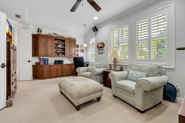 sitting room with light colored carpet, ceiling fan, and crown molding