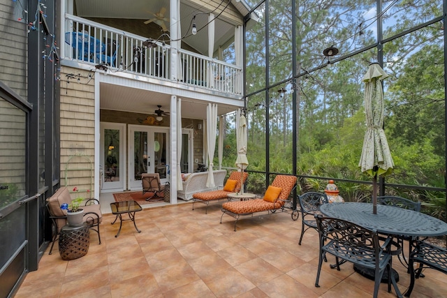 sunroom / solarium with ceiling fan