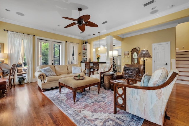 living room featuring french doors, hardwood / wood-style flooring, ceiling fan, and crown molding