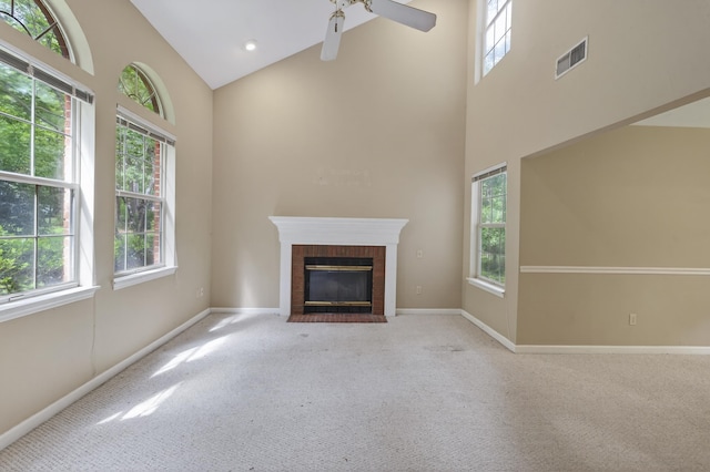 11022 Wildlife Trl, Tallahassee, FL 32312 - unfurnished living room with high vaulted ceiling, healthy amount of natural light, carpet flooring, and baseboards