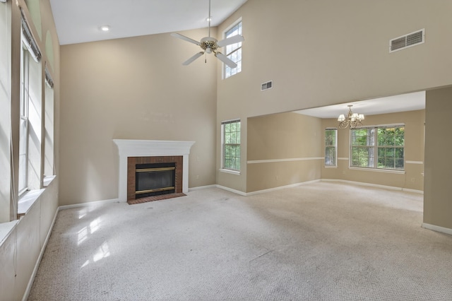 11022 Wildlife Trl, Tallahassee, FL 32312 - unfurnished living room with healthy amount of natural light, ceiling fan, a brick fireplace, and a high ceiling