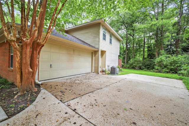 11022 Wildlife Trl, Tallahassee, FL 32312 - garage with concrete driveway and cooling unit