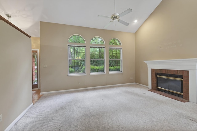 11022 Wildlife Trl, Tallahassee, FL 32312 - unfurnished living room featuring carpet flooring, ceiling fan, baseboards, high vaulted ceiling, and a brick fireplace