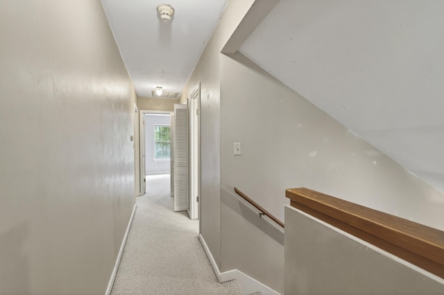 11022 Wildlife Trl, Tallahassee, FL 32312 - hall featuring an upstairs landing, baseboards, light carpet, and attic access