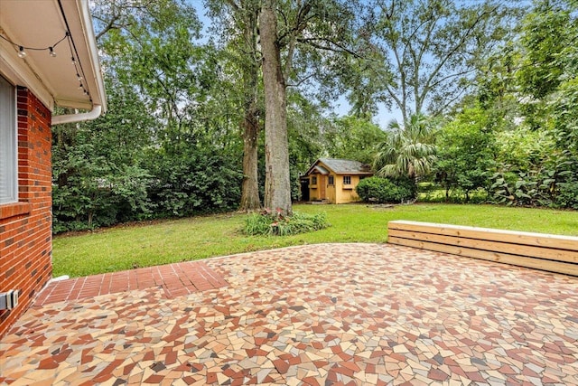 view of patio with an outbuilding