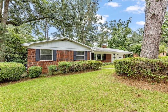 ranch-style house with a front lawn