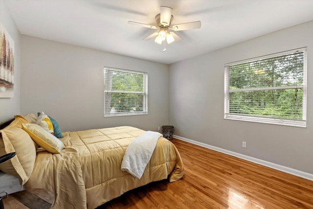 bedroom featuring hardwood / wood-style floors and ceiling fan