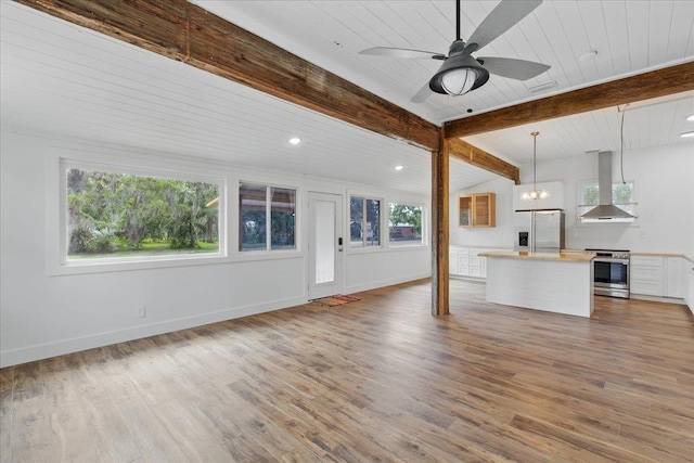 209 SE 10th St, Steinhatchee, FL 32359 - unfurnished living room featuring wood finished floors, recessed lighting, wood ceiling with exposed beams, baseboards, and a ceiling fan
