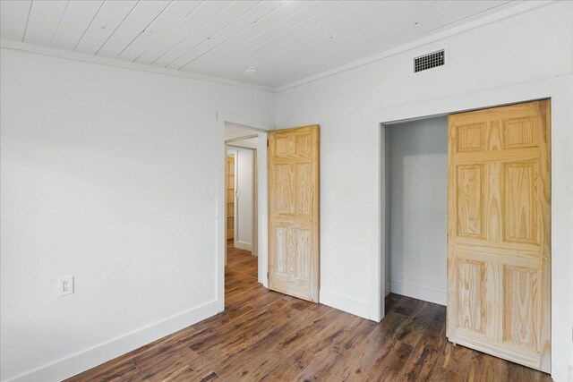 209 SE 10th St, Steinhatchee, FL 32359 - unfurnished bedroom with wood finished floors, baseboards, and crown molding