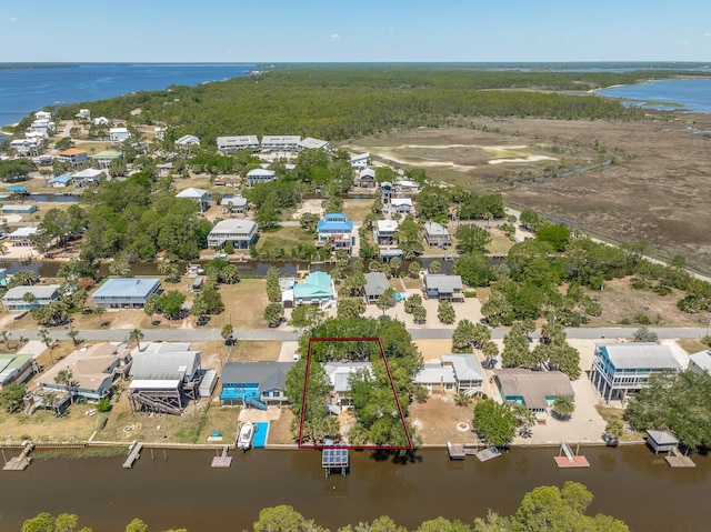 35 Sunrise Ln, Panacea, FL 32346 - aerial perspective of suburban area with a large body of water and property parcel outlined
