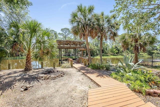 35 Sunrise Ln, Panacea, FL 32346 - view of patio / terrace featuring an outdoor fire pit, fence, and a water view