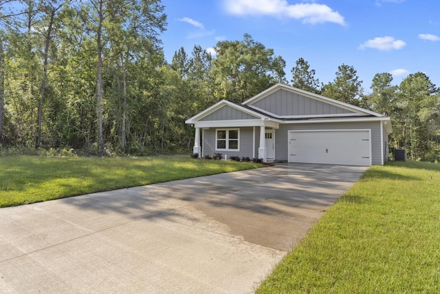 single story home featuring driveway, a garage, board and batten siding, and a front yard