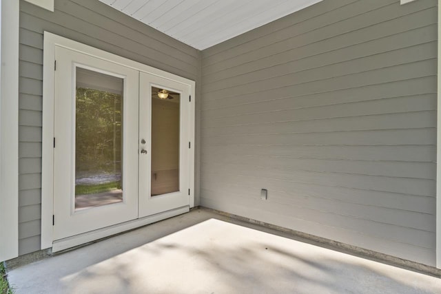 interior space featuring french doors, a patio, and baseboard heating