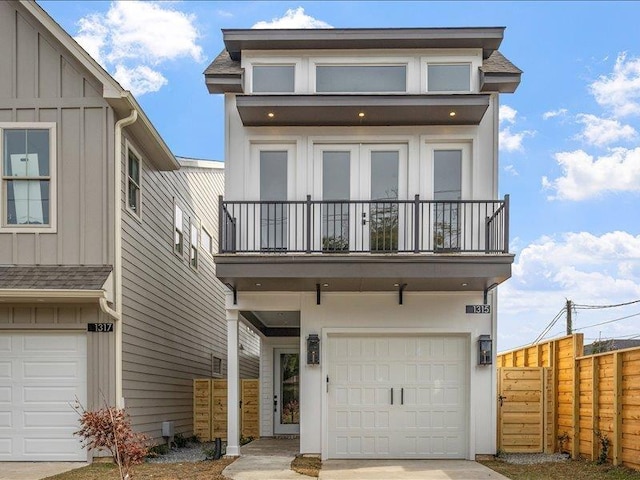 view of front of house with a balcony and a garage