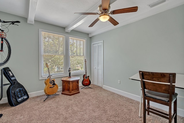 interior space with beamed ceiling, light colored carpet, a textured ceiling, and ceiling fan