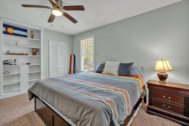 carpeted bedroom with a closet and ceiling fan