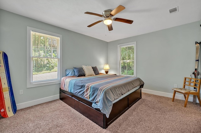 carpeted bedroom with ceiling fan