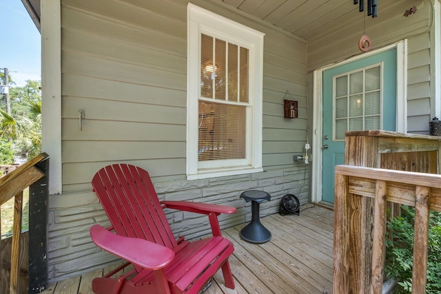 wooden terrace with a porch