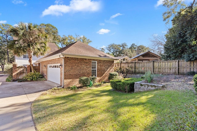 view of front of property with a garage and a front lawn