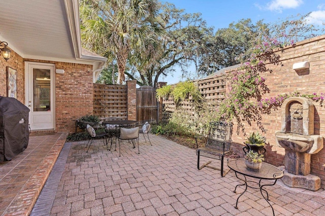 view of patio with a grill