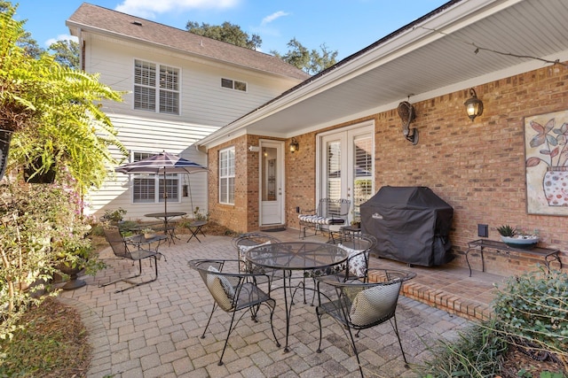 view of patio featuring a grill