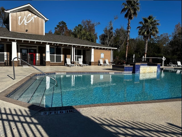 view of swimming pool featuring a patio