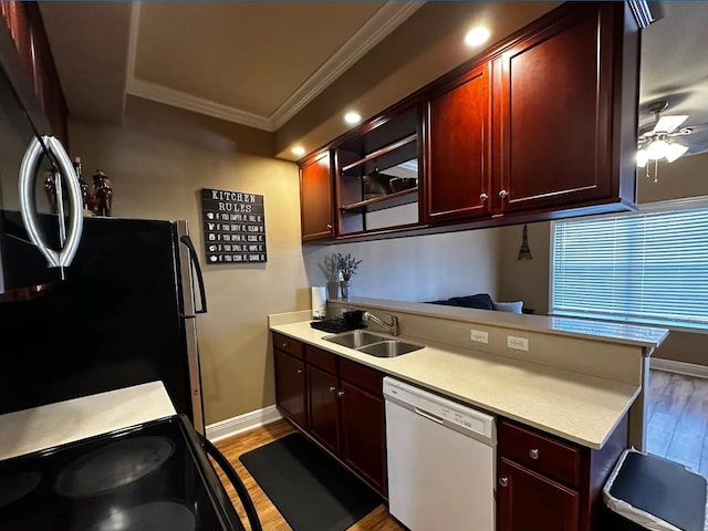 kitchen with sink, crown molding, stainless steel refrigerator, white dishwasher, and light hardwood / wood-style floors