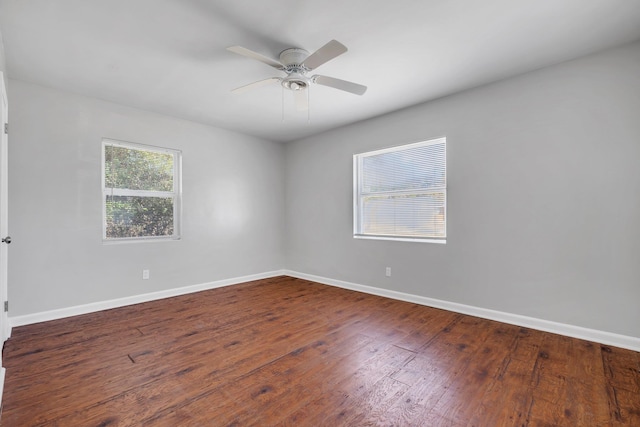 spare room featuring baseboards, ceiling fan, and hardwood / wood-style floors