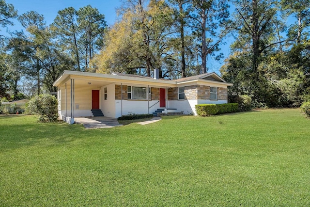 ranch-style home featuring entry steps, stone siding, a front lawn, and a carport