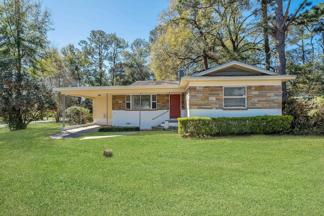 ranch-style home with stone siding, an attached carport, and a front yard