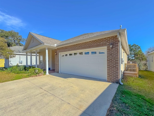 view of property exterior featuring a yard and a garage