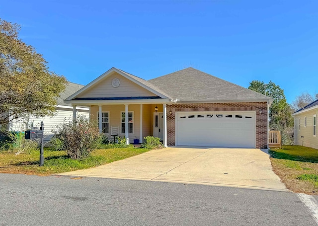 view of front of home with a porch and a garage