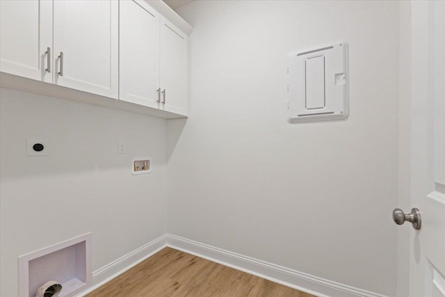 laundry area featuring cabinets, washer hookup, hookup for an electric dryer, light hardwood / wood-style flooring, and electric panel