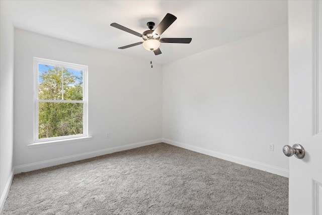 carpeted empty room with ceiling fan