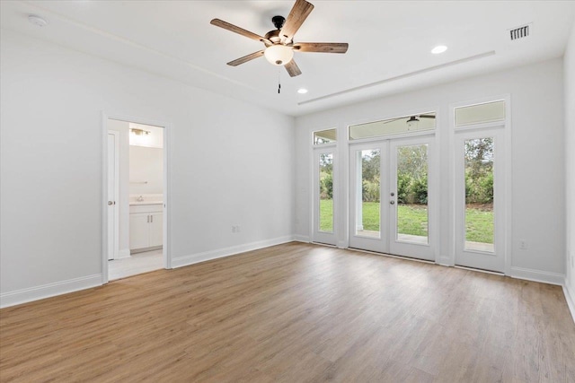 interior space with french doors, ceiling fan, and light hardwood / wood-style flooring