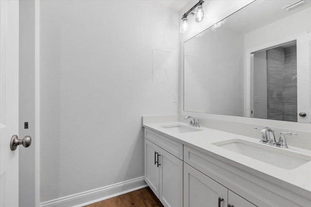 bathroom with vanity and hardwood / wood-style floors