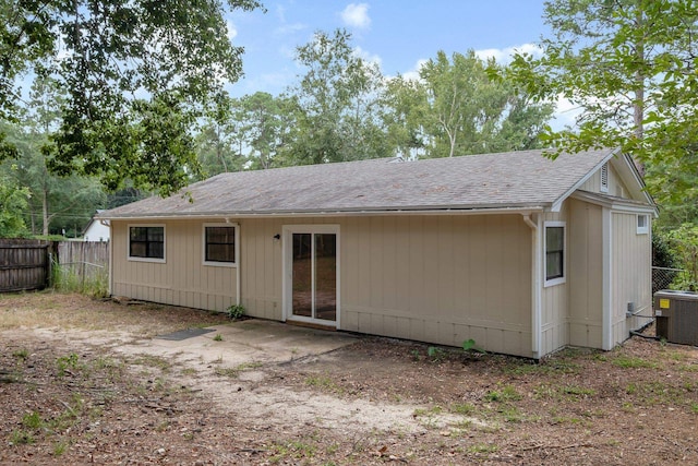 rear view of property featuring central AC unit