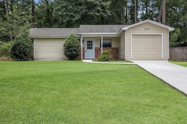 single story home with a garage and a front yard