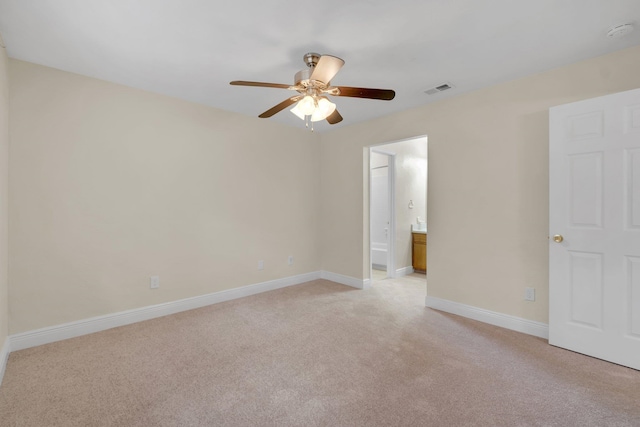 empty room with light colored carpet and ceiling fan