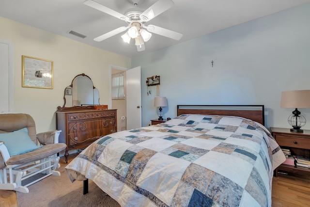 bedroom featuring light hardwood / wood-style floors and ceiling fan