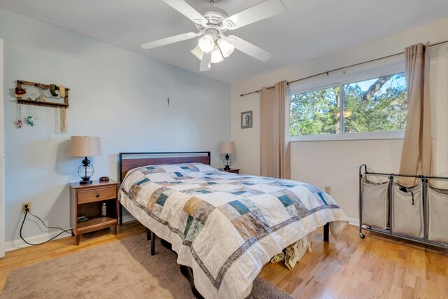 bedroom featuring hardwood / wood-style flooring and ceiling fan