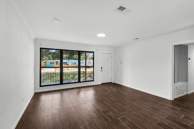 empty room with crown molding and dark hardwood / wood-style floors