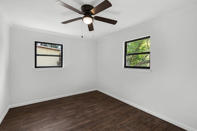 unfurnished room featuring dark wood-type flooring, ornamental molding, and ceiling fan