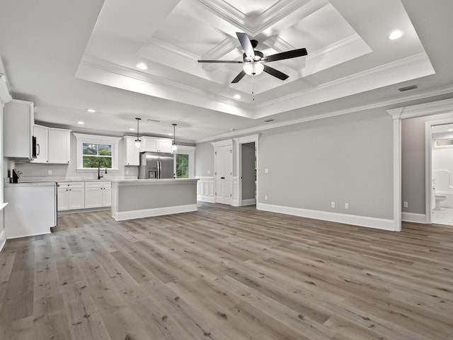 unfurnished living room with light wood-type flooring, crown molding, and ceiling fan
