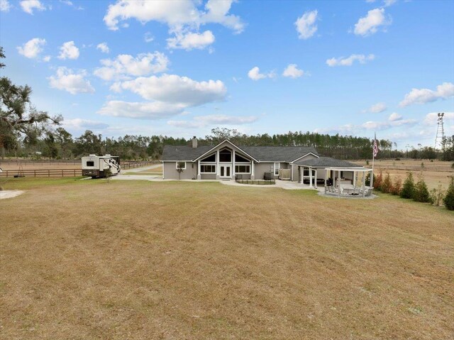 7087 Valhalla Ranch Dr, Perry, FL 32348 - back of house with a patio area and a chimney