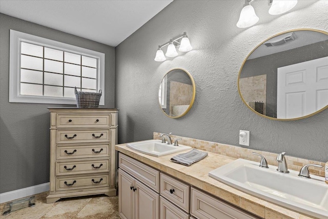 7087 Valhalla Ranch Dr, Perry, FL 32348 - bathroom featuring double vanity and baseboards