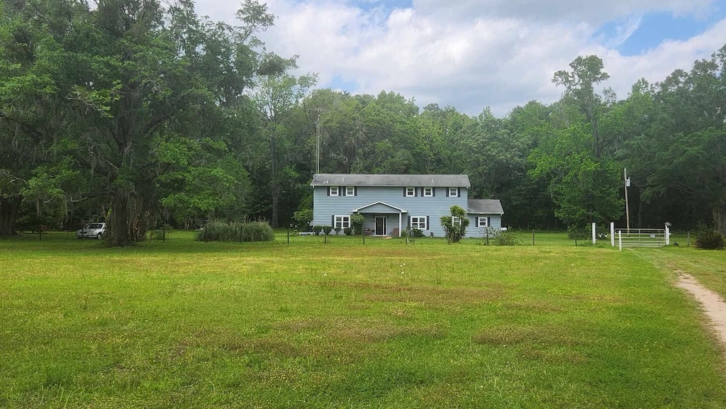 11072 Tung Grove Rd, Tallahassee, FL 32317 - exterior space with a view of trees and fence