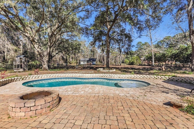 view of swimming pool featuring a patio area