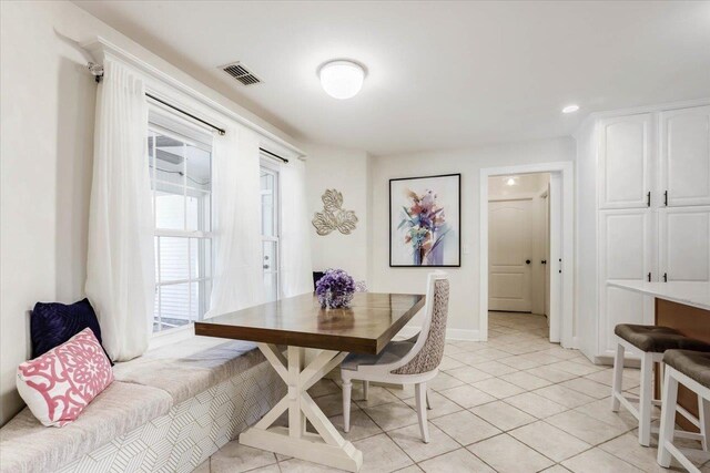 tiled dining space with breakfast area