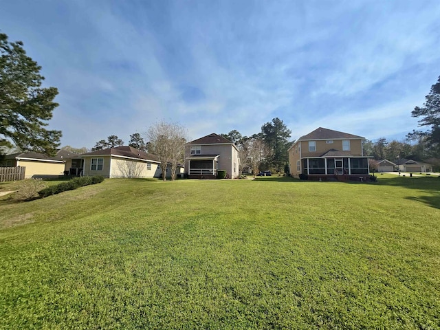 view of yard featuring a sunroom